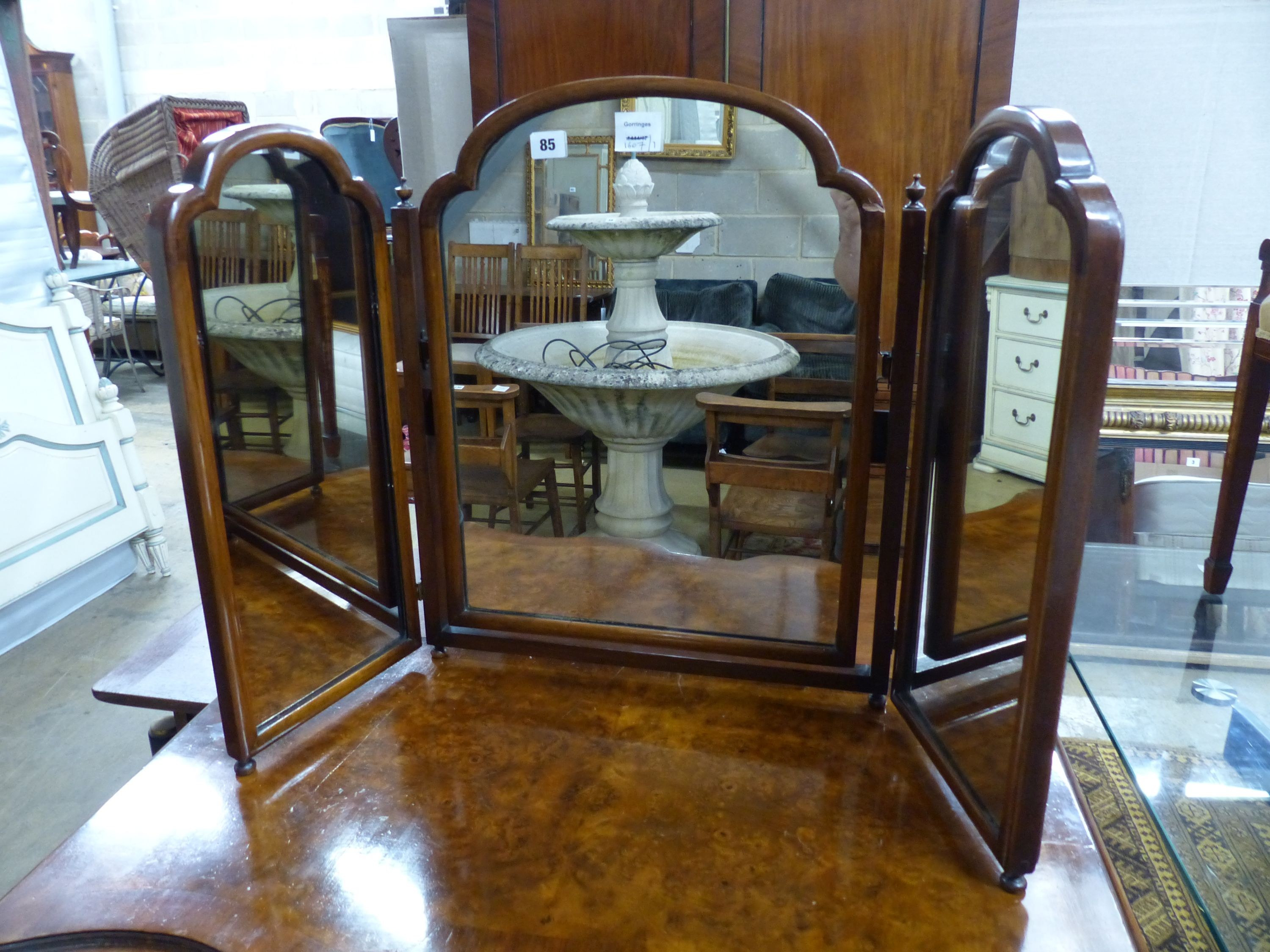 A Queen Anne Revival shaped front walnut chest, W.84cm D.49cm H.88cm, and a walnut triple dressing mirror